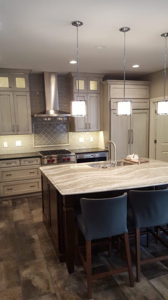 The renovated kitchen at the condo. The tile was ordered through Prosource, the cabinets were created by Kenrose Kitchen Kabinets and the counters were ordered through Stone Trends.
