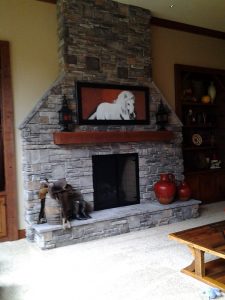 The fireplace is a huge feature in the room.